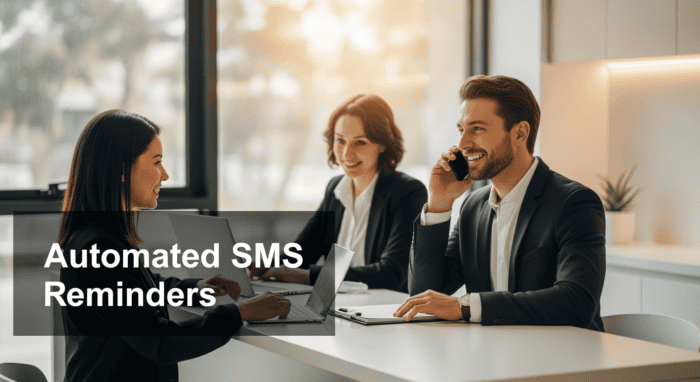 Business professionals discussing automated SMS reminders in a modern office, highlighting AiDial's communication solutions for efficient customer engagement.